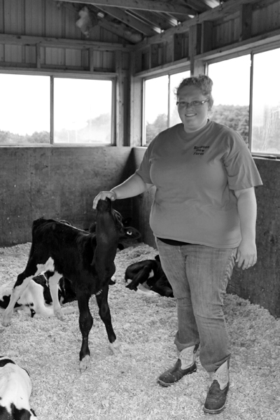Sarrah with one of her wards in the newborn pen. 