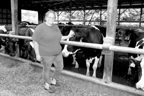 Sarrah with her former show cow Tia who is now part of the milking herd. 